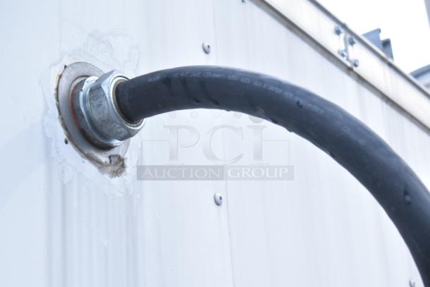 Close-up of a hose connection on a Stuff4less 24' unbranded shell food trailer, 2019 model, ready for outfitting.