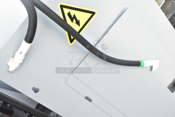 Electrical panel in SDG 20' unbranded food trailer, featuring caution symbol. Ready for equipment installation.