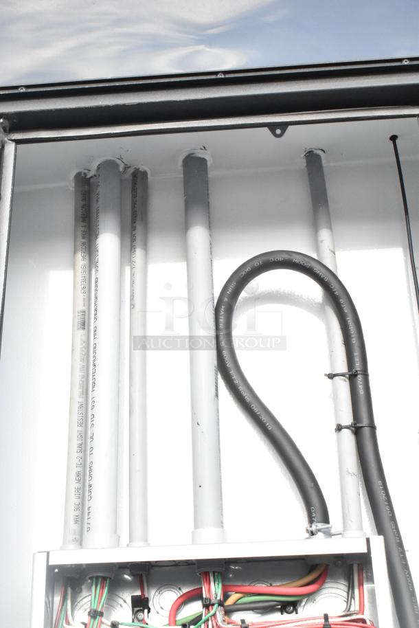 SDG 20' food trailer detail view showing interior piping and wiring, ready for appliance outfitting, equipped with sinks.