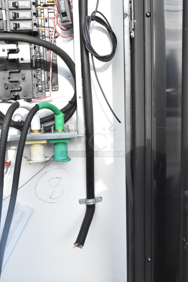 Electrical wiring and fixtures in an SDG 20' food trailer. Ready to be outfitted. Includes hand and mop sinks. Clear title.