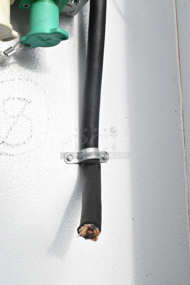 Broken electrical cable inside SDG 20' unbranded shell food trailer. Ready for outfitting, featuring hand sink and mop sink. Sold with clear title.