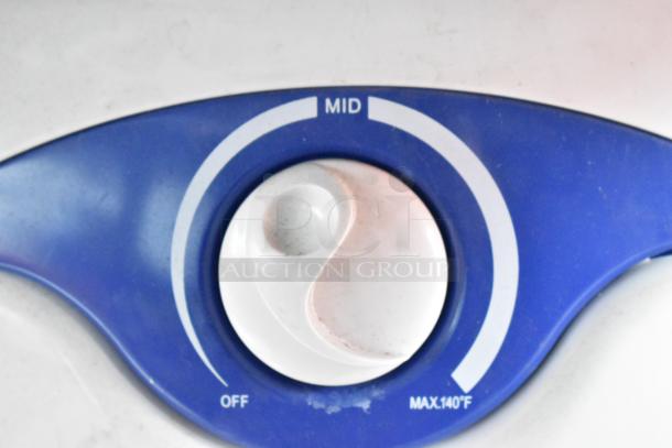 Blue temperature control knob labeled "MID," "OFF," and "MAX.140°F."