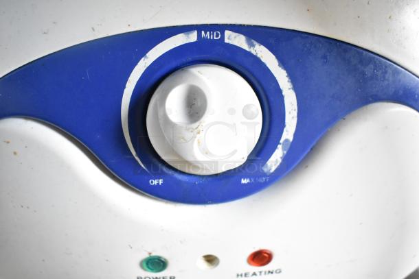 Knob control with blue dial markings labeled "OFF," "MID," and "MAX 140°F," with power and heating indicators below.