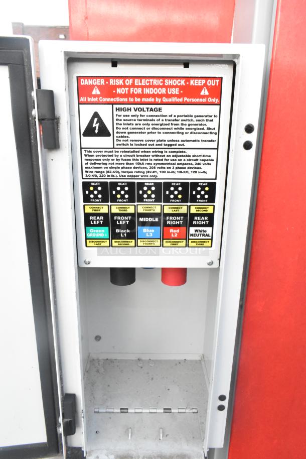 Electrical panel of a Rock Solid Cargo mobile kitchen trailer with high voltage warning label and connection instructions.