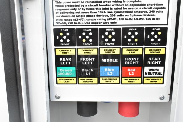Electrical panel inside Rock Solid Cargo mobile kitchen trailer showing wiring instructions and connection color codes.
