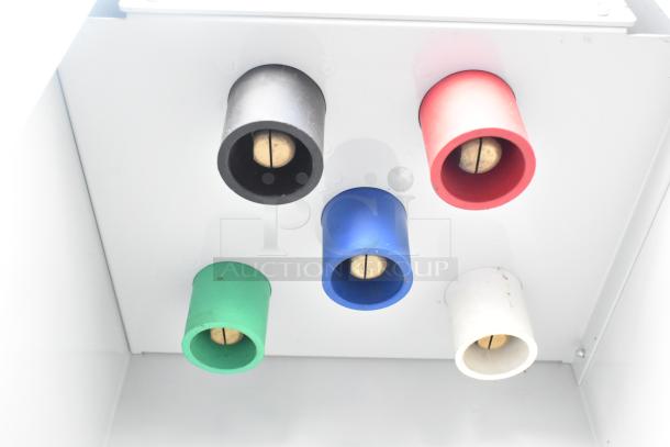 Close-up of color-coded plumbing or electrical connectors inside the 2021 Rock Solid Cargo trailer.