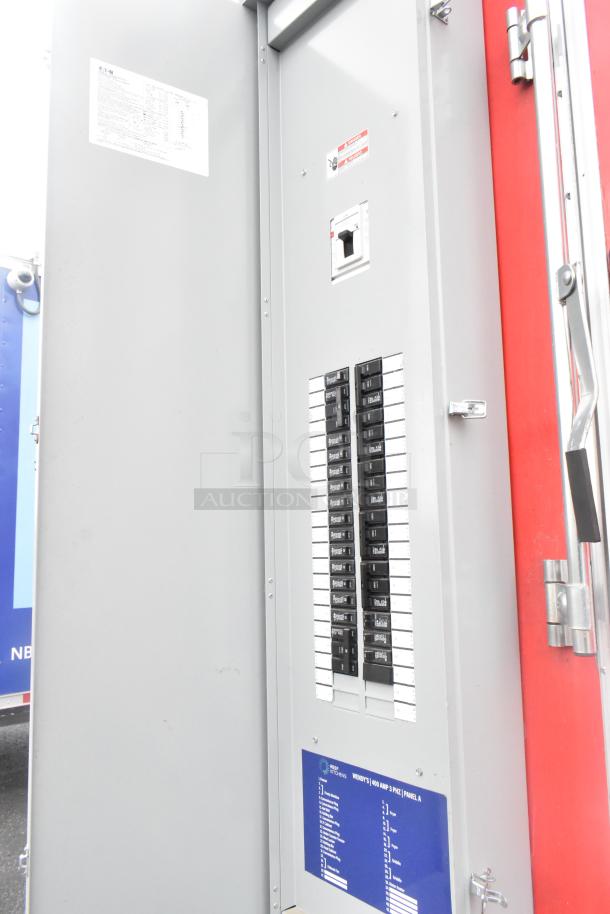 Electrical panel inside Rock Solid Cargo 28' fast food trailer, labeled "WENDY'S 400 AMP 3 PHASE PANEL A," featuring various switches.