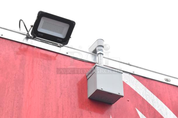 Red Rock Solid Cargo trailer, exterior light fixture and junction box visible, suitable for fast-food business setup.