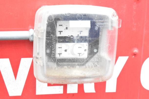 Intermatic weatherproof electrical outlet cover on Rock Solid Cargo fast food trailer exterior.