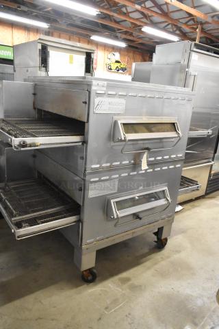 Middleby Marshall PS540G stainless steel conveyor pizza oven, natural gas, commercial casters, dual openings, model branding visible.
