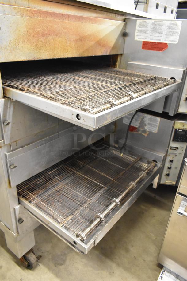 Middleby Marshall PS540G stainless steel conveyor pizza oven, natural gas, 110,000 BTU, on commercial casters. Visible rust.