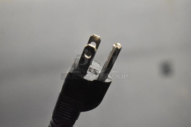 Close-up of a power plug, possibly for the Galaxy 177GSM3 Frozen Beverage Machine, showing standard 120-volt prongs.