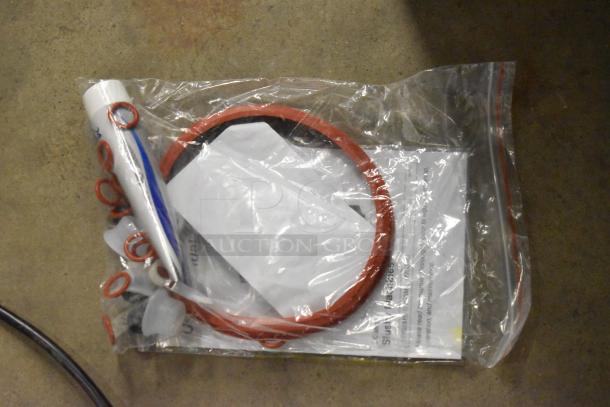 Bag of spare parts and accessories for a Galaxy 177GSM3 beverage machine, including rubber rings and instructions.