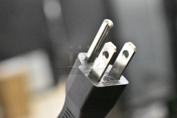 Close-up of a three-prong plug for a Galaxy 177GSM2 Granita Machine. Model info and voltage details visible. New condition.