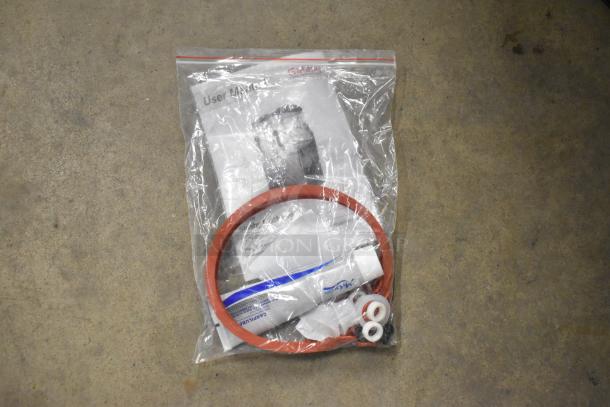 Sealed bag of accessories for Galaxy 177GSM2 beverage machine, including user manual, red gasket, and small parts.