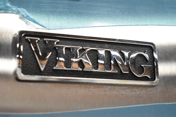 Viking stainless steel logo on a scratch and dent 2-door cooler and freezer, 115 volts, 1 phase, brand new condition.