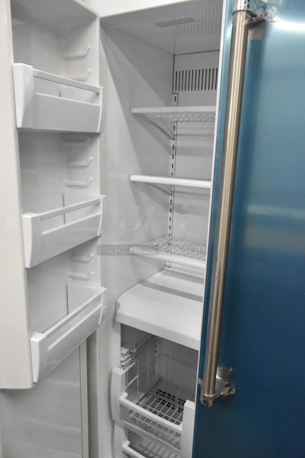 Stainless steel Viking 2-door cooler and freezer, brand new with minor scratches, 115V, 1 phase. Interior shelving visible.