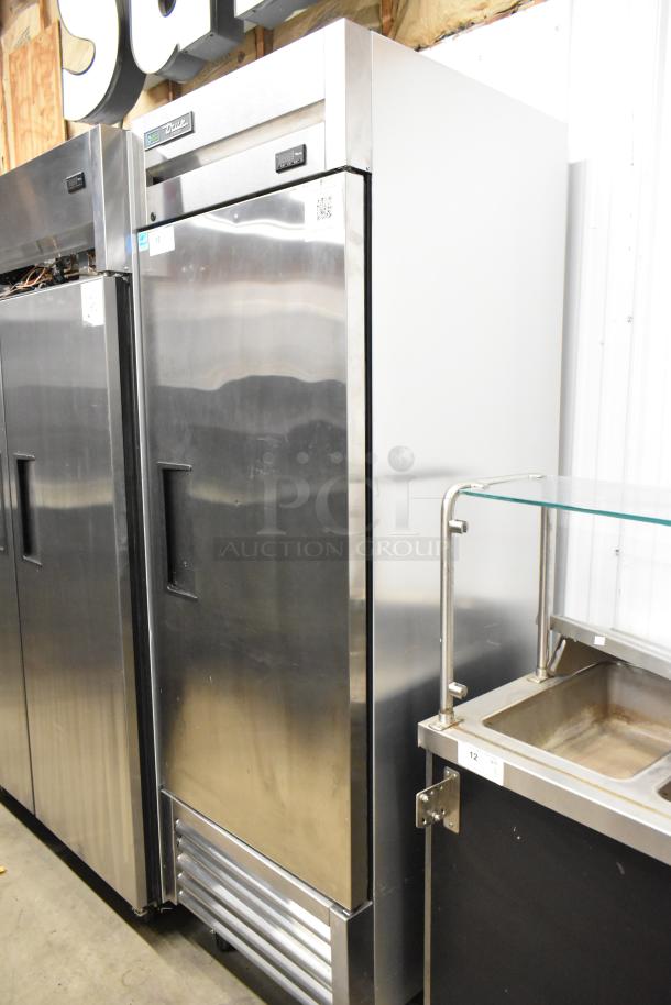 2021 True T-23F-HC stainless steel reach-in freezer, single door, poly-coated racks, commercial casters, excellent condition.