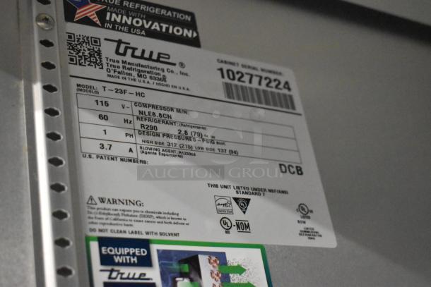 Label for True T-23F-HC Commercial Freezer, indicating model, voltage, refrigerant, and certification details.