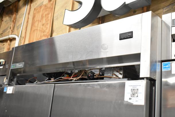 2022 True TG2R-2S-HC stainless steel 2-door commercial cooler with digital display and Energy Star rating on casters.