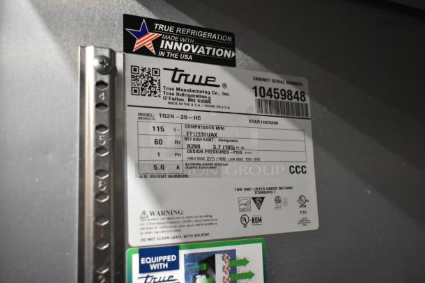 2022 True TG2R-2S-HC reach-in cooler label with model, voltage, refrigerant info, and certifications.