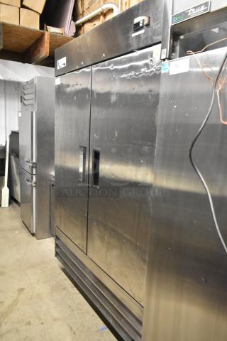 Avantco 178A49FHC stainless steel commercial 2-door reach-in freezer with poly-coated racks, on commercial casters.
