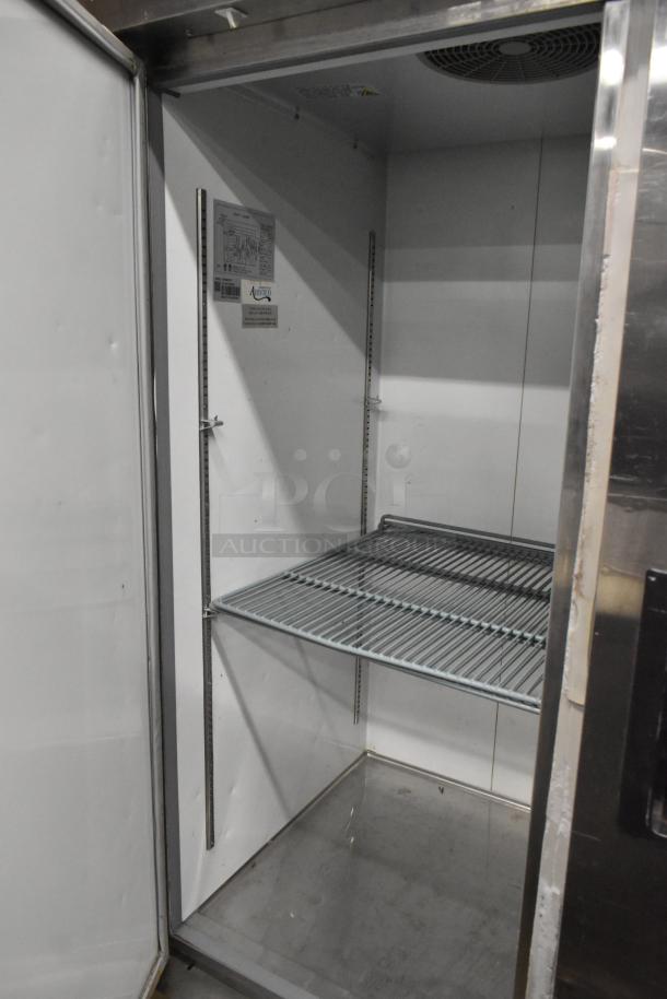 Avantco 178A49FHC stainless steel commercial 2-door reach-in freezer with poly-coated racks, on casters, 115V, 1 phase.
