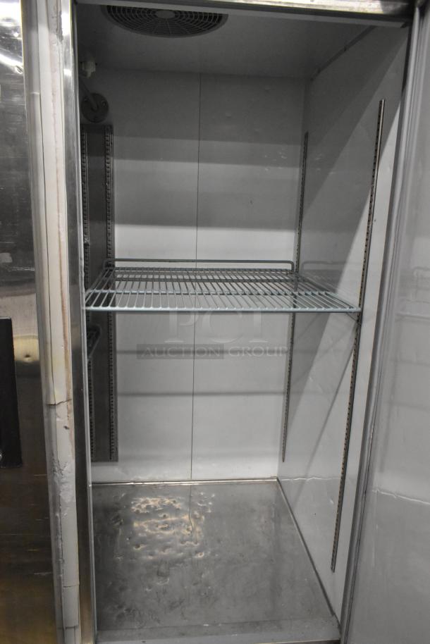 Avantco 178A49FHC stainless steel commercial freezer interior with poly coated racks, on commercial casters, 115V, 1-phase.