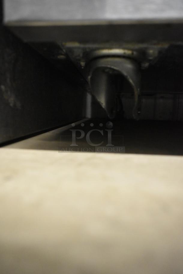 Delfield 406CA stainless steel undercounter cooler, commercial single door, on casters, missing one caster, 115V, 1 phase.