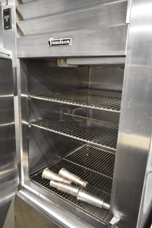 Traulsen RHT132W-HHS stainless steel commercial cooler, 2 half-size doors, interior shelving, 115V, good condition.