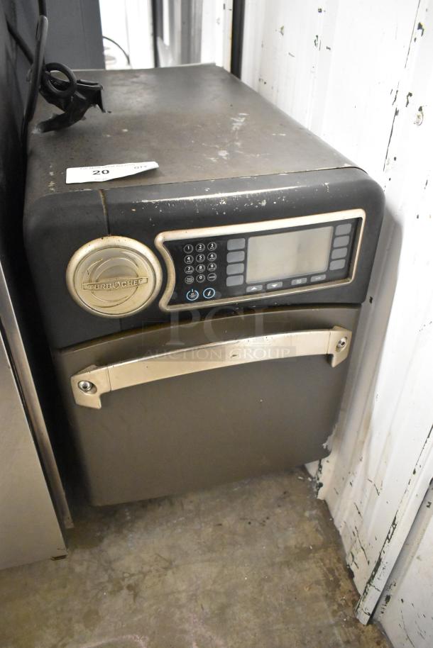 Turbochef NGO metal commercial rapid cook oven, 208/240V, 1 phase. Features digital controls, visible wear, model label.