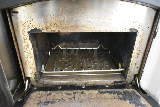 Turbochef NGO metal rapid cook oven interior showing wear, featuring electric power, 208/240V, 1 phase.