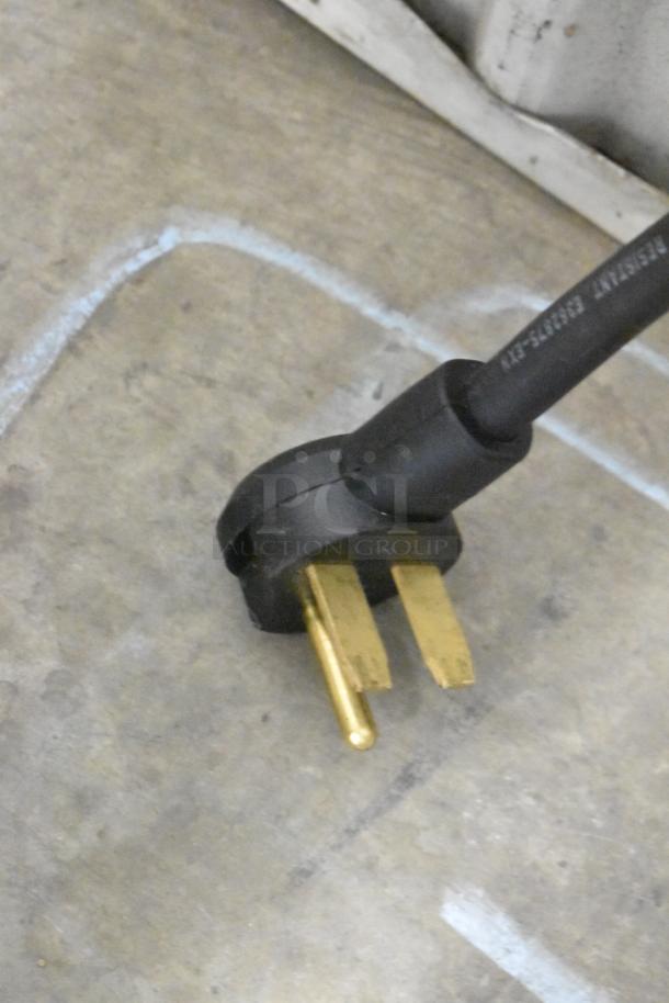 Close-up of a power plug for a Turbochef Encore 2 commercial rapid cook oven, compatible with 208/240 Volts, 1 Phase.