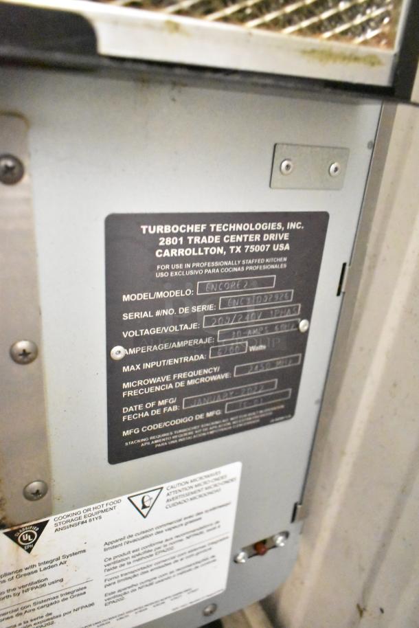 Turbochef Encore 2 stainless steel rapid cook oven label showing model info, serial no., voltage, and manufacturing details.