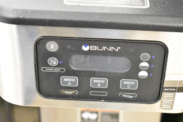 2020 Bunn ICB SH stainless steel commercial coffee machine with hot water dispenser. Features brew options and batch settings.