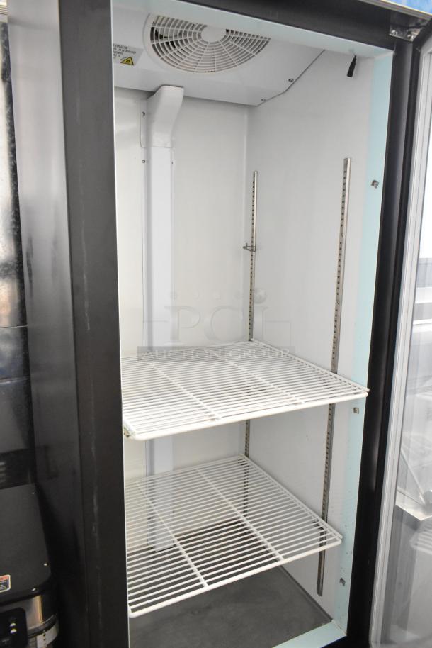 Coldline D12-B commercial reach-in cooler with poly coated racks, single door, on commercial casters. 115V, 1-phase.