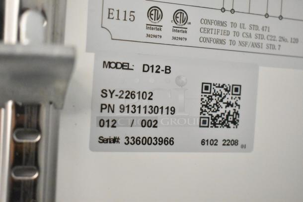 Coldline D12-B label showing model, serial number 336003966, and certification details for commercial cooler.