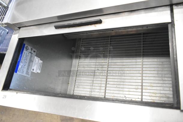 Beverage Air GF48L stainless steel back bar cooler with 2 sliding lids, visible label detailing 115V, 1 Phase specs.