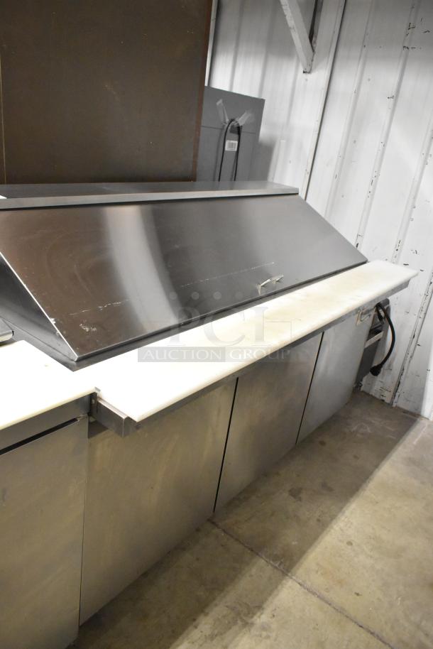 Avantco 178SSPT71MHC stainless steel sandwich salad prep table with Bain Marie mega top, on commercial casters.