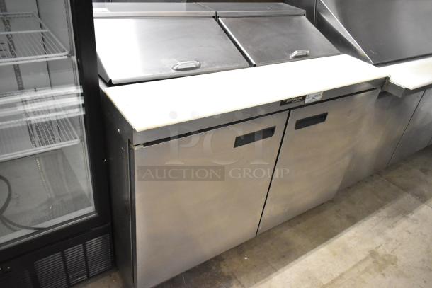 Delfield 4448N-12 stainless steel sandwich prep table with mega top, bain marie, and commercial casters, 115V, 1 phase.