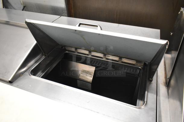 Delfield 4448N-12 stainless steel prep table, bain marie top, open lid, on commercial casters, 115V, 1 phase.