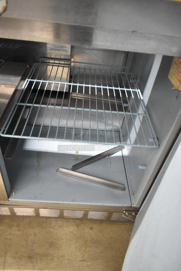 Delfield 4448N-12 stainless steel commercial sandwich prep table, Bain Marie top, caster wheels, 115V, 1 phase.