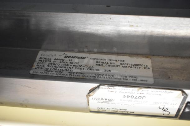 Delfield 4448N-12 model label with specifications, including 115V, 1 phase, and serial number 0807152002018.