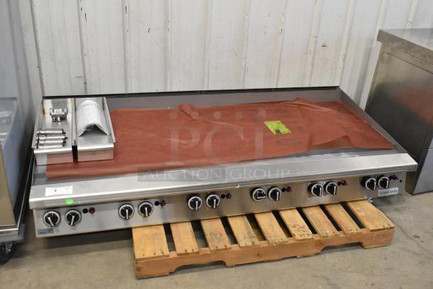 Brand new Garland stainless steel commercial countertop flat top griddle. Scratch and dent condition, multiple controls visible.