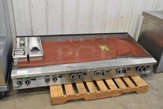 Brand new Garland stainless steel commercial countertop flat top griddle. Scratch and dent condition, multiple controls visible.