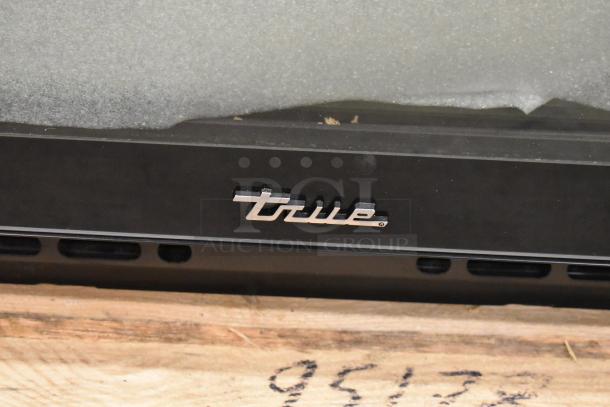 True CVM-27-HC commercial cooler logo on glass door, 30" one-section merchandiser, poly-coated racks featured.