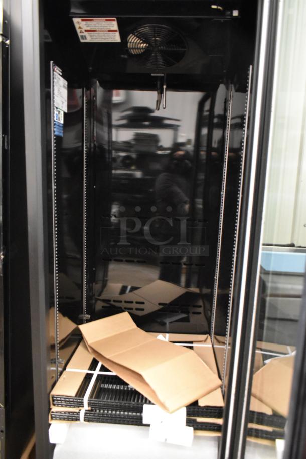 Brand new True CVM-27-HC commercial glass door cooler, 30", with poly coated racks, 115V, 1 Phase, minor scratches.