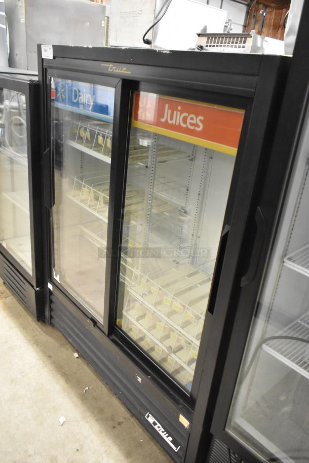 True GDM-41SL-60-LD commercial cooler with two glass doors, poly-coated racks, and branding labels for dairy and juices. 115V, 1 phase.