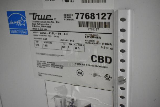 True GDM-41SL-60-LD commercial cooler label showing model details, 115V, Energy Star rated, suitable for outdoor use.