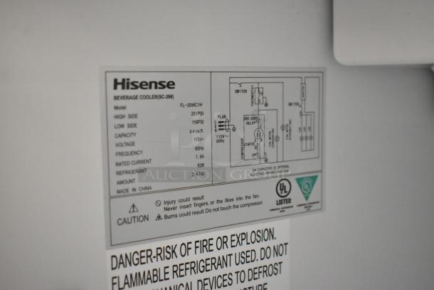 Label on Hisense FL-35WC1H cooler with specs: 9.4 cu. ft. capacity, 115V, 60Hz. Warnings about flammable refrigerant and electrical diagram.